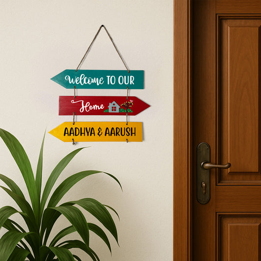 Welcome To Our Home Hand-Painted Wooden Three Arrow Plank Name Plate For Home - Multicolor