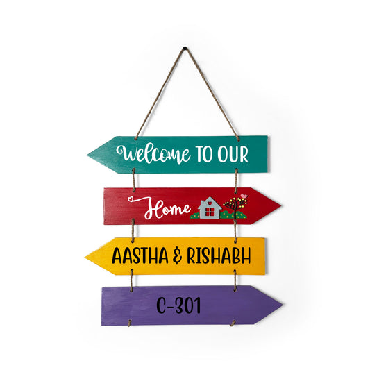 Welcome To Our Home Hand-Painted Wooden Four Arrow Plank Name Plate For Home - Multicolor