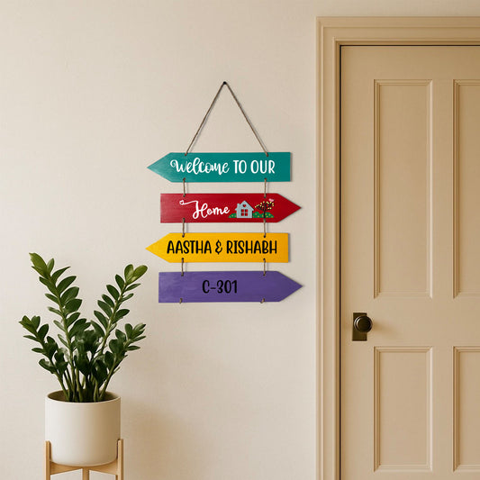 Welcome To Our Home Hand-Painted Wooden Four Arrow Plank Name Plate For Home - Multicolor